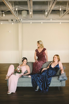 JB Jumpsuit in Georgette, $180, A.V. Max Gold Circle Hoops, $30; Twigs. Chanii B Luca Heel, $290; Morgan’s Shoes. Jade by Jasmine Cranberry Ruched Velvet Gown, $429; Vera’s House of Bridals. James Navy Velvet Gown, $319, Opal Earrings, $125; Vera’s House of Bridals. Vince Lanica Silver Pandora Boots, $395; Twigs.