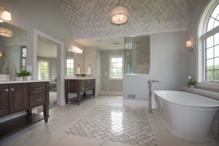 A highly customized owner's suite bathroom reveals the innovative design options that are available to homeowners