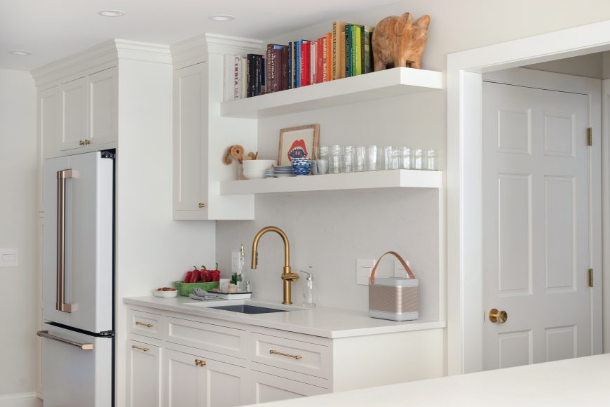 When their kitchen appliances started to fail, that was the couple’s push to begin their house renovation. Now, a handsome GE Café refrigerator and stove take center stage in the space. The Bosch dishwasher to the right of the sink is hidden behind sleek custom cabinetry.
