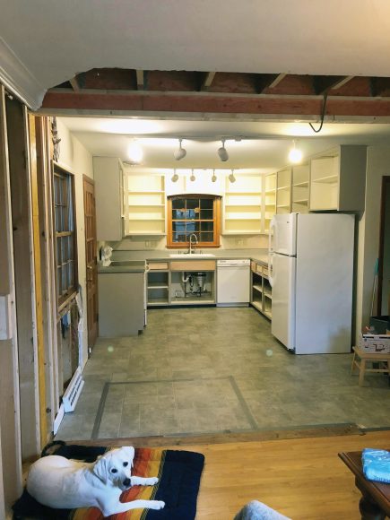 Shown is a before image of the Klein’s kitchen, which faced the front of the house, with a wall separating it from the dining room.