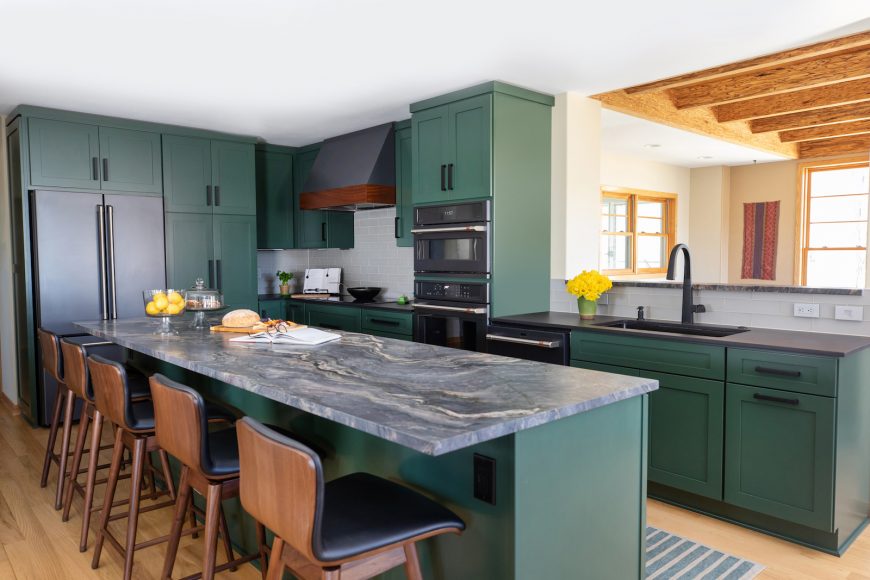 Green With Envy

Jodie Amerell, NCIDQ, ASID of Mojo Home Interiors, believes that they were ahead of the trend when the green cabinets were installed in June 2020. “Make sure you love green and the shade,” Amerell says to others who want to take the green plunge. “Order paint samples to make sure it’s a color you can live with.”