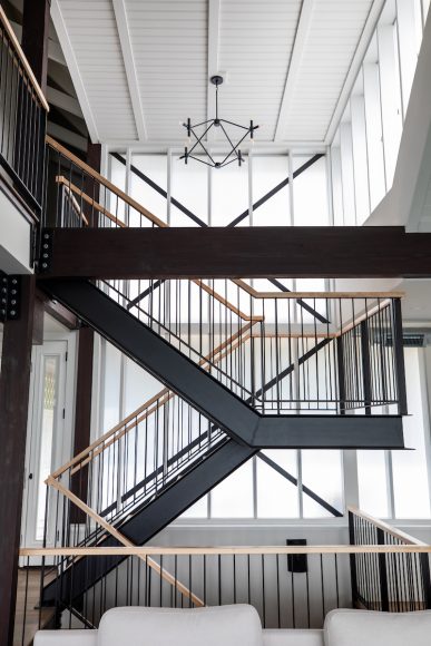 One of the home’s focal points is the dramatic, free-floating staircase linking the main and second levels. The custom-built steel structure features sold maple treads and railings.
