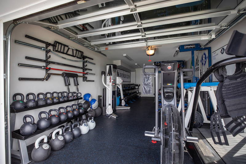 Space for a full home gym was essential to the couple, who are both in the fitness industry. The attached boathouse was the perfect spot, and even came heated.