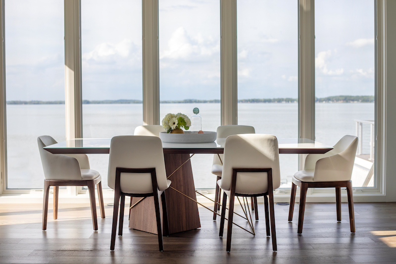 The couple transformed a sprawling sunroom into their dining room, where it’s easy to enjoy lake views out the floor-to-ceiling windows. To ensure Lake Kegonsa is always the focal point, the two selected a stylish, yet unobtrusive, dining set from Rove Concepts.