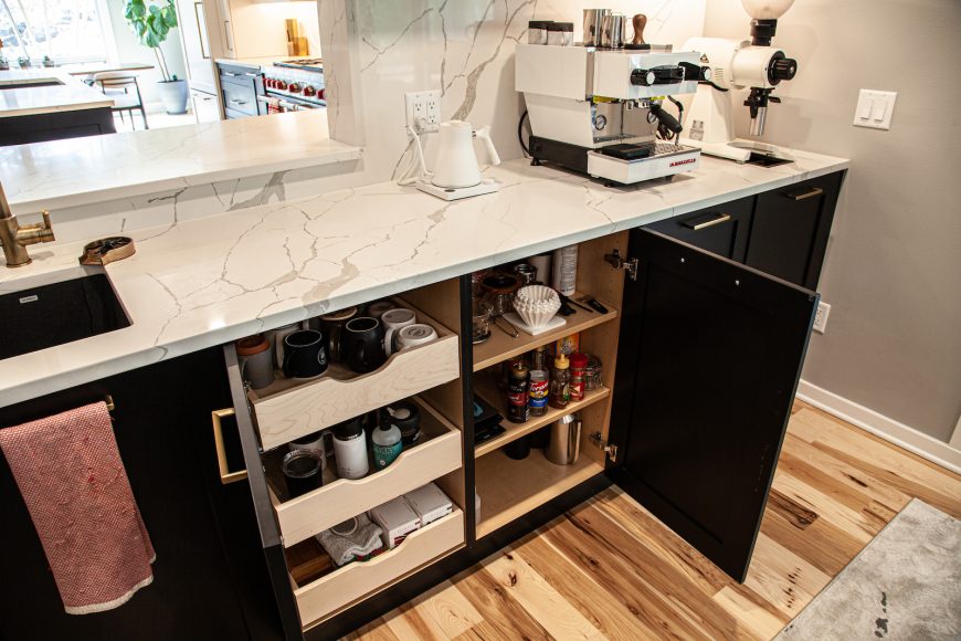 SMART STORAGE: The couple designed shelves to perfectly hold all
of their barista needs — coffee mugs, espresso cups and a timer to ensure the perfect pour-over and more.