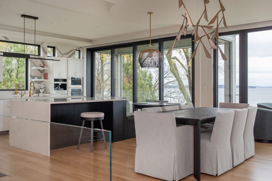 The kitchen and dining area feature a wealth of large windows so Lake Mendota is always visible.