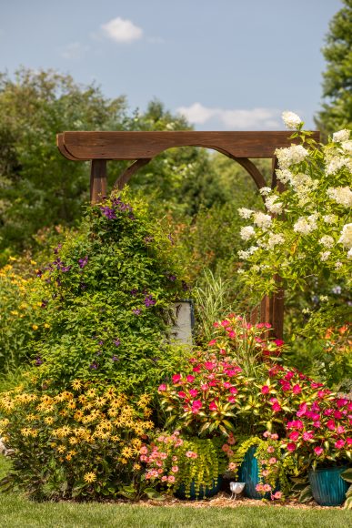 As a retired physical education teacher, Hemenway loves to create interactive experiences for her garden visitors. One of her favorites: a scavenger hunt featuring 30 white bird figurines hidden throughout her garden — and she challenges guests to find all of them. Can you spot one in the image above?