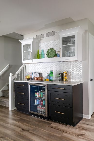 The Cappozzos’ new bar used to be a “dead” wall, Katie says. Now, the family has easy access to drinks in the fridge plus more storage space.
