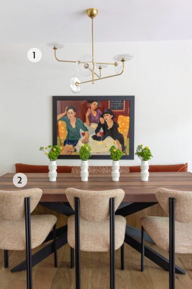 1. Goeser says the homeowner’s painting in the dining room served as the inspiration for the entire first floor’s color palette. The sleek Visual Comfort light fixture adds a shot of style to the space, but doesn’t compete with the artwork. 2. There’s plenty of seating around the homeowner’s custom walnut dining table. The built-in banquette is covered in dark orange velvet fabric with a swipe of velvet leopard-print fabric down the middle “to give it a little extra interest,” says Goeser.