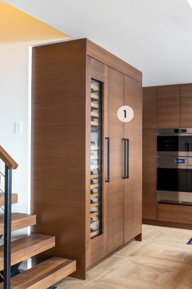 1. The side-by-side Sub-Zero refrigerator and wine cooler were panel-ready, allowing the appliances to blend seamlessly with the surrounding cabinetry for a built-in look. The wine fridge holds 59 bottles and has separate temperature zones for bottles of reds and whites.