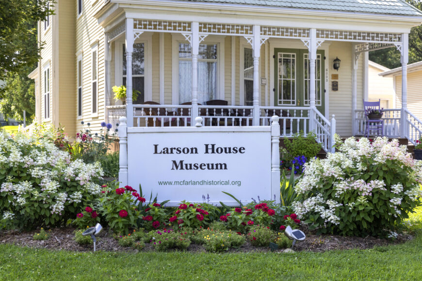 Gail Aaroen, garden chair of the Larson House Museum, says the group planted red and bright pink Dragon Wing begonias this spring in the gardens.