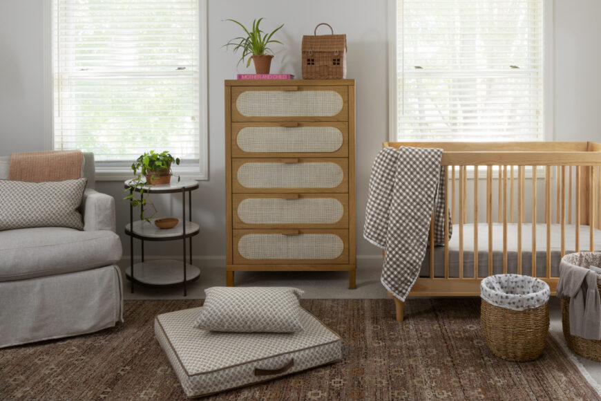 The convertible Babyletto baby crib is draped in Quince’s chocolate gingham bedding. Franklin found another practical piece in the comfy swivel rocker, which is covered in a treated linen-blend fabric that resists stains.