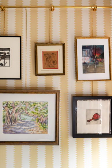 The gallery wall features pieces by local makers, works collected during the family’s travels and art gifted from friends. Payne points out the gallery rail allows for artwork to be easily swapped in and out without damaging the wall.